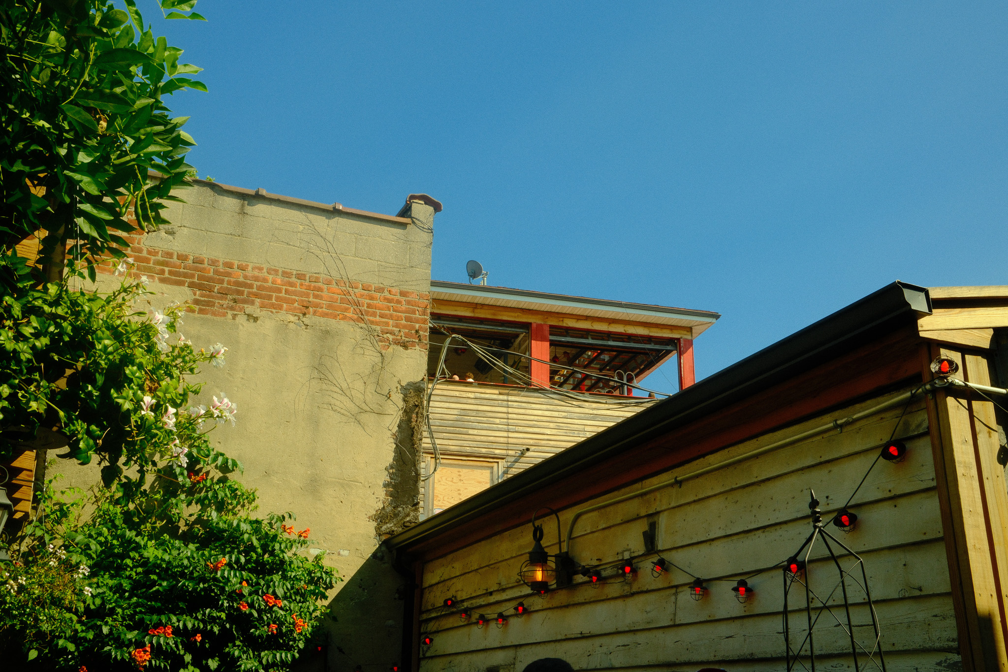 The corner of a few brick buildings in the golden hour
