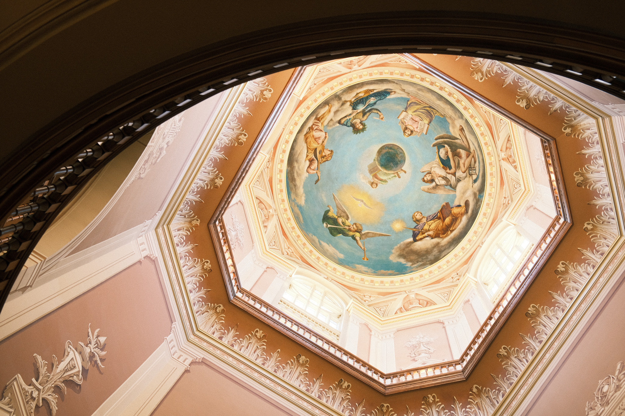 The inside of a painted dome looking up from the floor