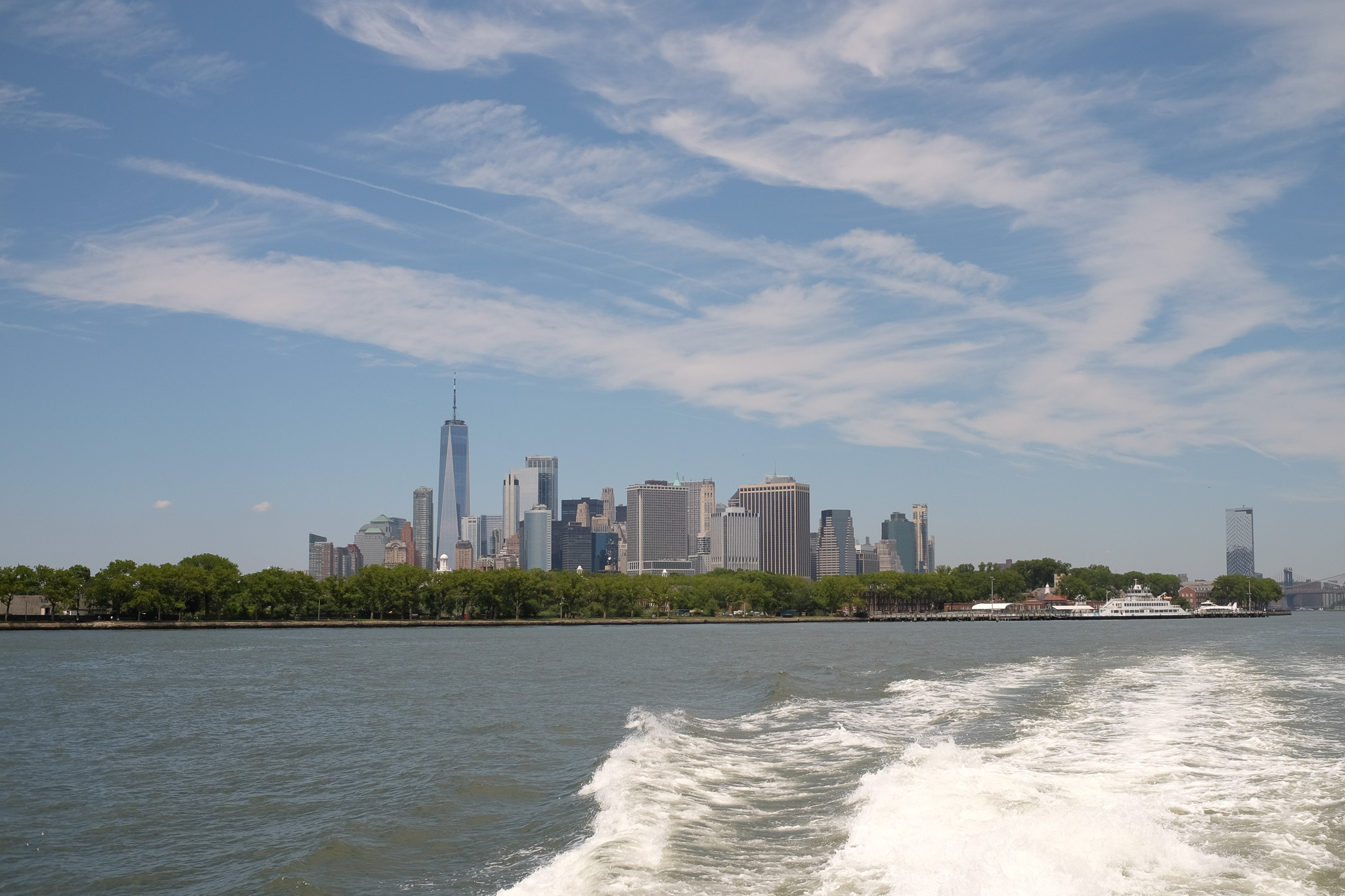 Manhattan's Financial District as seen from the rear of a ferry.