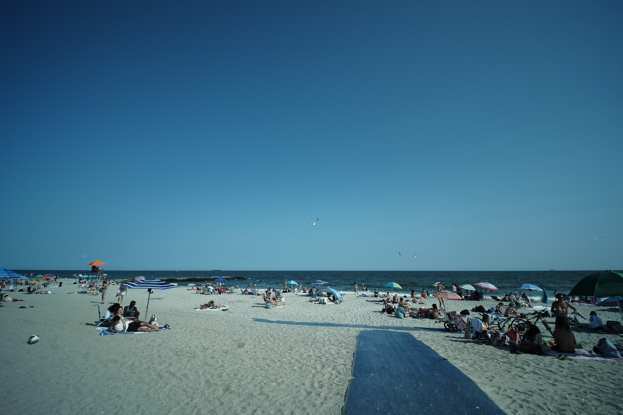 The Far Rockaway Beach full of people in th summer.