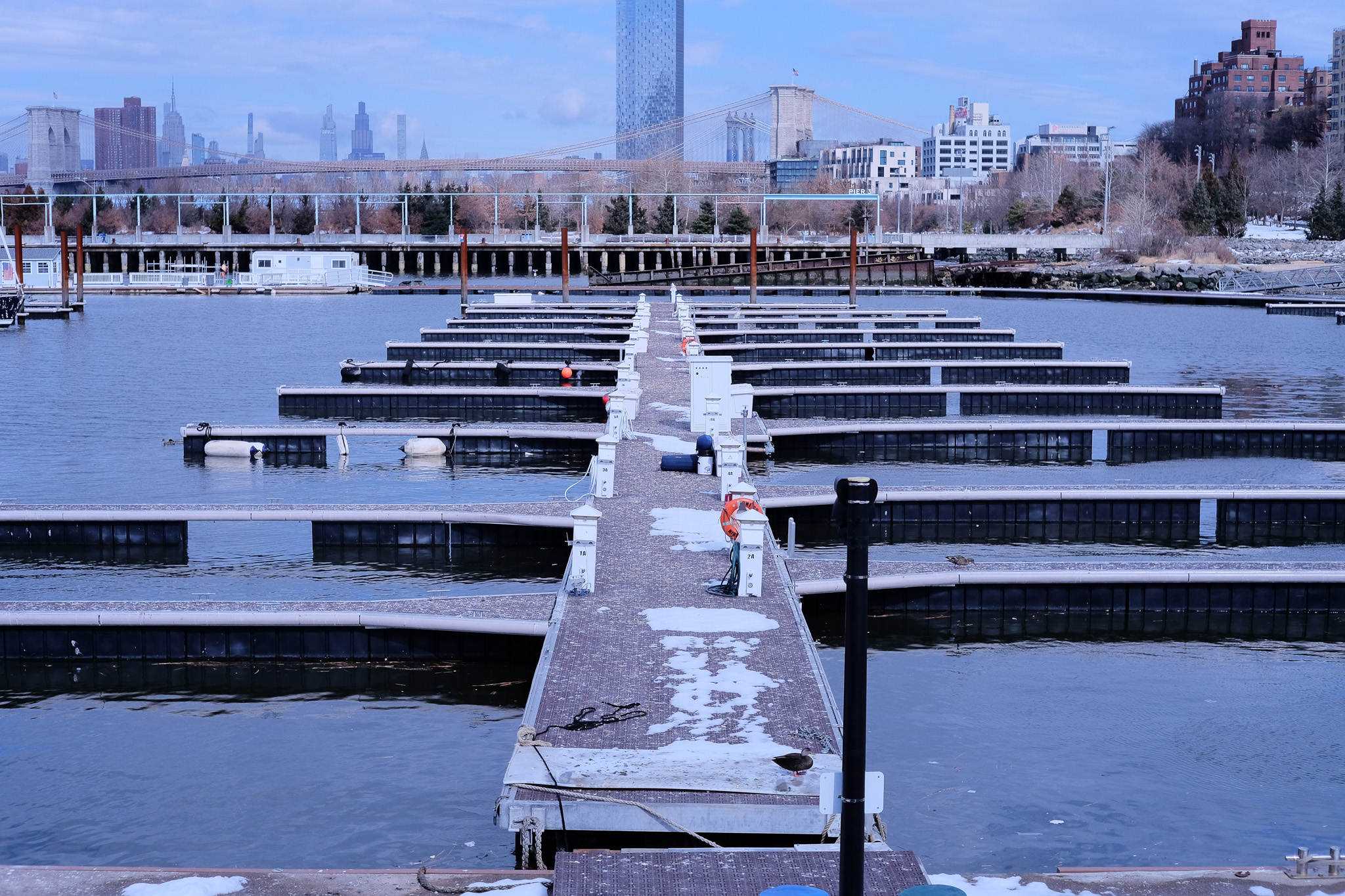 An empty set of slips in the Brooklyn Bridge Marina